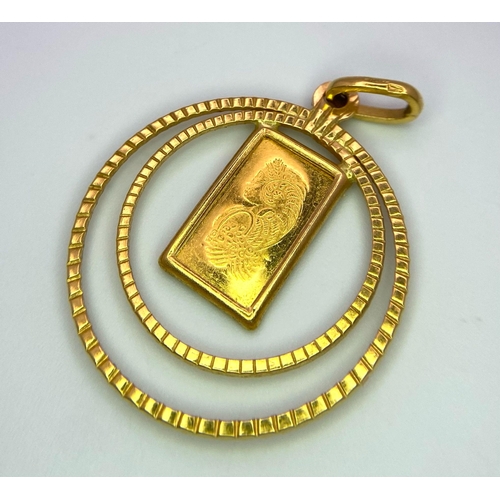 74 - A Fine Gold (.999 purity) Ingot Pendant - set in 21k Gold yellow circles. 3.5cm. Ingot - 1g. Total w... 