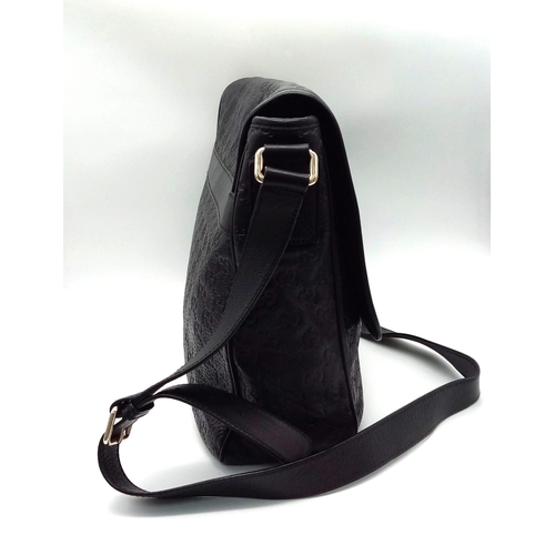 76 - A Gucci Monogram Guccissima Medium Black Leather Handbag, Black Canvas Interior with Interior Zip an... 