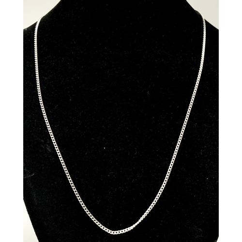 770 - A 60cms SOLID SILVER CURB CHAIN .  6.8gms