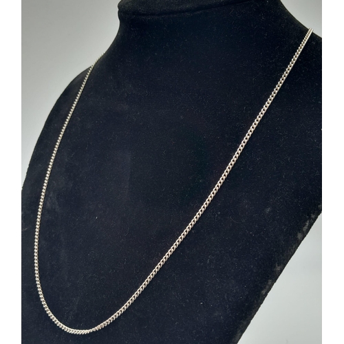 770 - A 60cms SOLID SILVER CURB CHAIN .  6.8gms