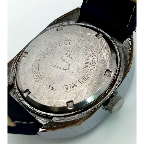 758 - A Vintage Sorna 17 Jewel Jump Watch. Blue leather strap. Stainless steel case - 36mm. Black dial wit... 