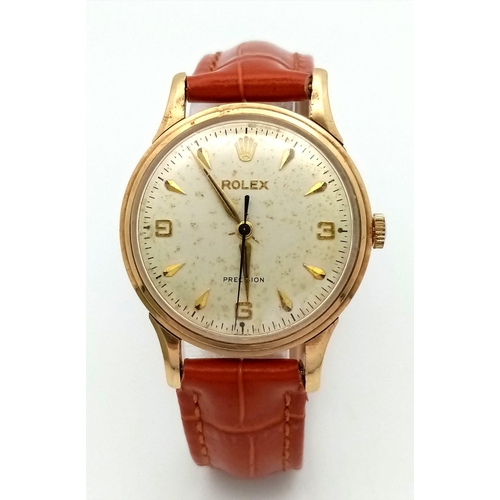 102 - A Vintage (Early 1960s) Rolex Precision 9K Gold Cased Gents Watch. Brown leather strap. 9K gold case... 