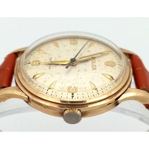 102 - A Vintage (Early 1960s) Rolex Precision 9K Gold Cased Gents Watch. Brown leather strap. 9K gold case... 