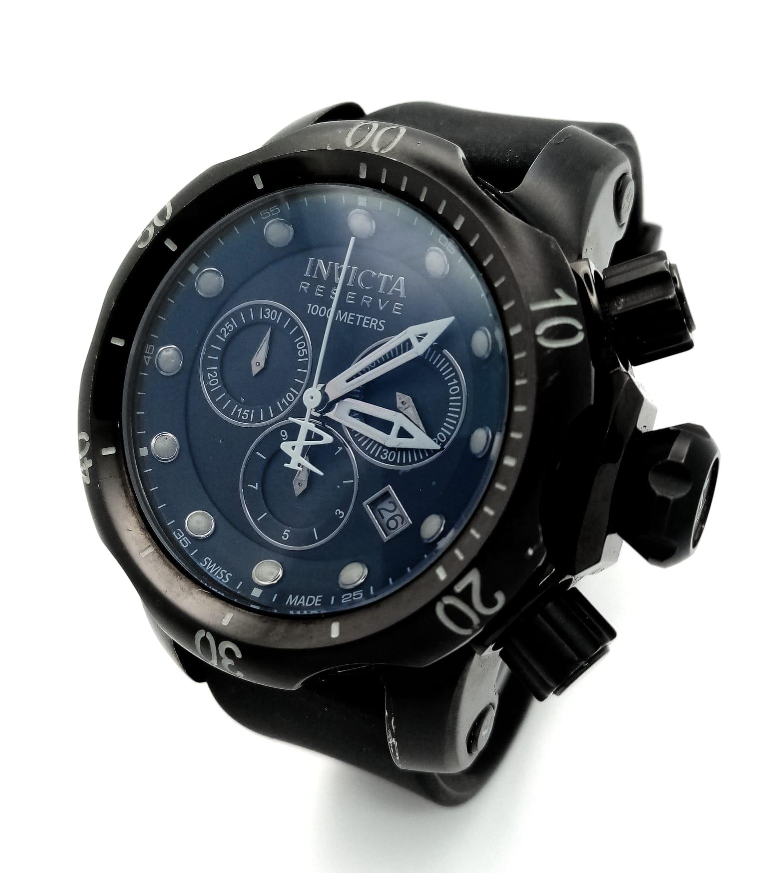 An Invicta Reserve 1000 Meters Gents Chronograph Watch. Black rubber strap. Two tone rugged stainles