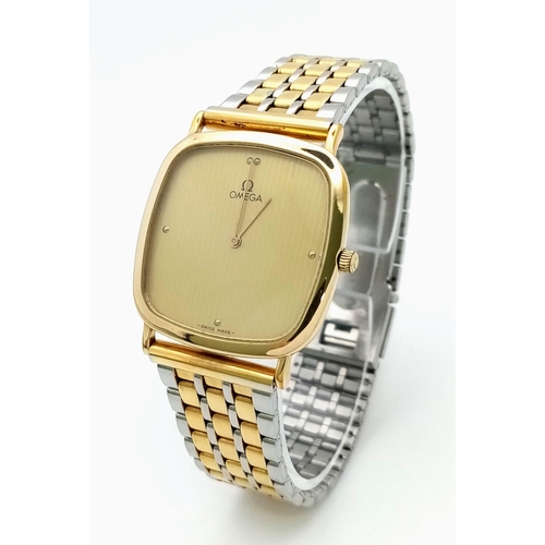 479 - A Classic Omega Deville Gents Quartz Watch. Two tone bracelet and case - 30mm. Gold tone dial. In wo... 