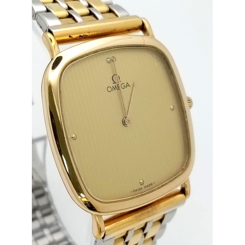 479 - A Classic Omega Deville Gents Quartz Watch. Two tone bracelet and case - 30mm. Gold tone dial. In wo... 