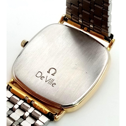 479 - A Classic Omega Deville Gents Quartz Watch. Two tone bracelet and case - 30mm. Gold tone dial. In wo... 