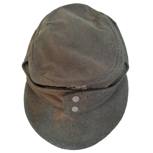 197 - 3rd Reich Waffen SS M43 Cap. very small cut on the top. A real “Been There” item.