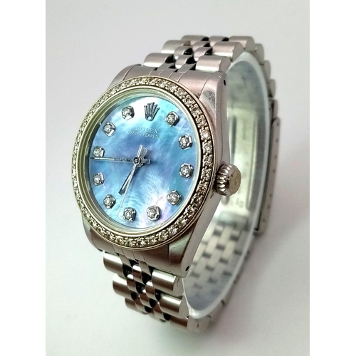 355 - A LADIES ROLEX DRESS WATCH WITH DIAMOND NUMERALS AND BEZEL , MOTHER OF PEARL DIAL AND AUTOMATIC MOVE... 