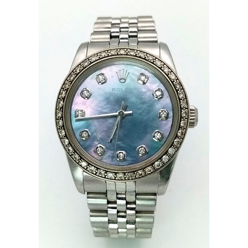 355 - A LADIES ROLEX DRESS WATCH WITH DIAMOND NUMERALS AND BEZEL , MOTHER OF PEARL DIAL AND AUTOMATIC MOVE... 