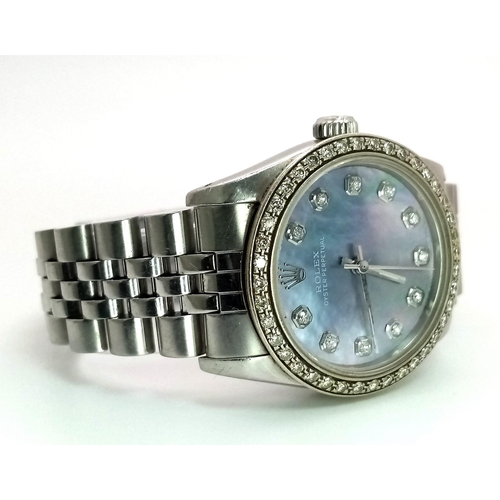 355 - A LADIES ROLEX DRESS WATCH WITH DIAMOND NUMERALS AND BEZEL , MOTHER OF PEARL DIAL AND AUTOMATIC MOVE... 