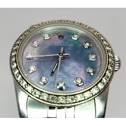 355 - A LADIES ROLEX DRESS WATCH WITH DIAMOND NUMERALS AND BEZEL , MOTHER OF PEARL DIAL AND AUTOMATIC MOVE... 