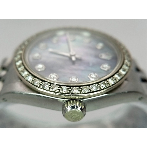 355 - A LADIES ROLEX DRESS WATCH WITH DIAMOND NUMERALS AND BEZEL , MOTHER OF PEARL DIAL AND AUTOMATIC MOVE... 