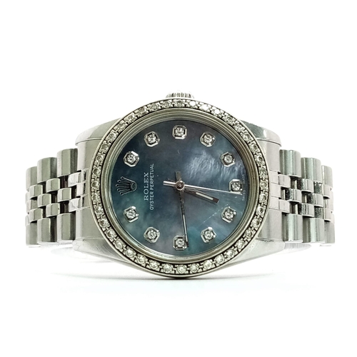 355 - A LADIES ROLEX DRESS WATCH WITH DIAMOND NUMERALS AND BEZEL , MOTHER OF PEARL DIAL AND AUTOMATIC MOVE... 