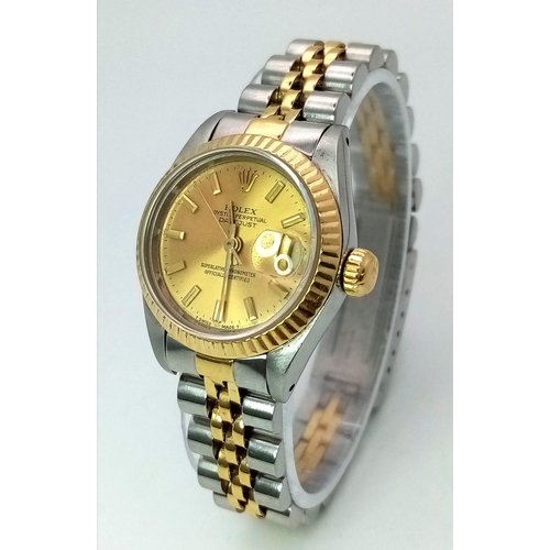 363 - A ROLEX LADIES OYSTER PERPETUAL DATEJUST IN BI-METAL WITH CLASSIC GOLDTONE DIAL .  26mm