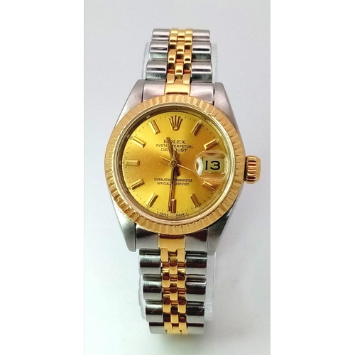 363 - A ROLEX LADIES OYSTER PERPETUAL DATEJUST IN BI-METAL WITH CLASSIC GOLDTONE DIAL .  26mm