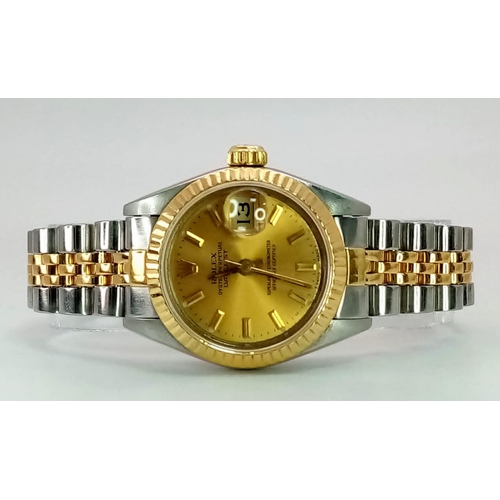 363 - A ROLEX LADIES OYSTER PERPETUAL DATEJUST IN BI-METAL WITH CLASSIC GOLDTONE DIAL .  26mm