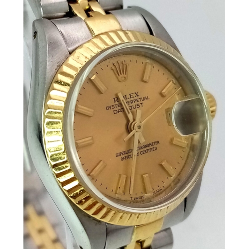 363 - A ROLEX LADIES OYSTER PERPETUAL DATEJUST IN BI-METAL WITH CLASSIC GOLDTONE DIAL .  26mm