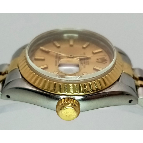 363 - A ROLEX LADIES OYSTER PERPETUAL DATEJUST IN BI-METAL WITH CLASSIC GOLDTONE DIAL .  26mm