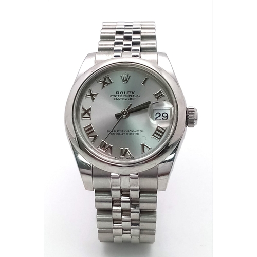 136 - A MID SIZE ROLEX PERPETUAL DATEJUST IN STAINLESS STEEL WITH SILVERTONE DIAL AND ROMAN NUMERALS .   3... 