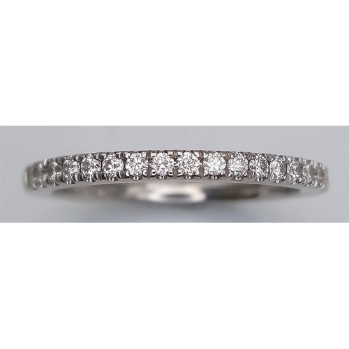 141 - A 18K WHITE GOLD VERA WANG LOVE DIAMOND SET HALF ETERNITY RING 0.23CT. 3G SIZE P