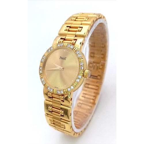 173 - A STUNNING PIAGET 18K GOLD LADIES DRESS WATCH WITH DIAMOND BEZEL , QUARTZ MOVEMENT . GOLDTONE DIAL A... 