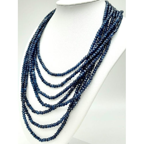 174 - A magnificent, seven row necklace with faceted dark blue sapphire rondelles. Length: 43-54 cm, weigh... 