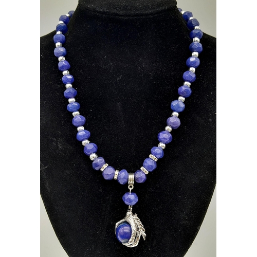 181 - A fashionable, multifaceted lapis lazuli necklace with an eagle’s claw pendant (symbolising power & ... 