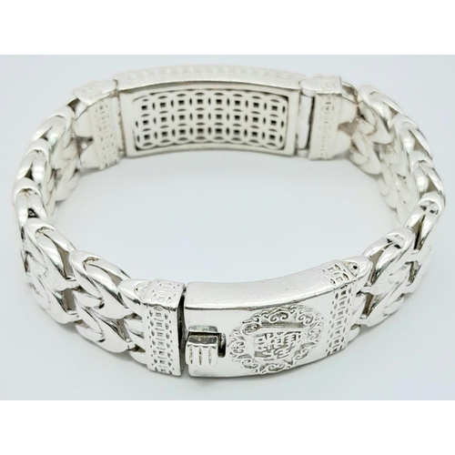 188 - Of special interest to Feng Shui followers, a gents, substantial, Chinese, silver, bracelet with a p... 