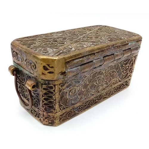 215 - An Antique Bronze Indian Spice Chest.
Beautiful intricate scroll design. Under the lid, 4 compartmen... 