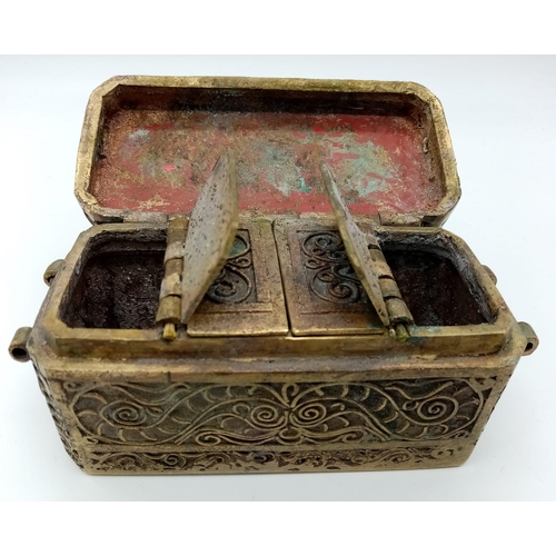 215 - An Antique Bronze Indian Spice Chest.
Beautiful intricate scroll design. Under the lid, 4 compartmen... 