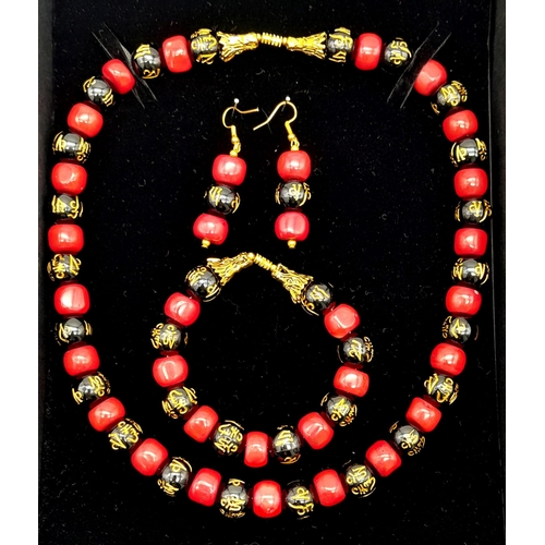 230 - An original “GOOD LUCK” necklace, bracelet and earrings set with natural red coral alternating with ... 