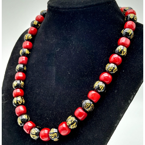 230 - An original “GOOD LUCK” necklace, bracelet and earrings set with natural red coral alternating with ... 