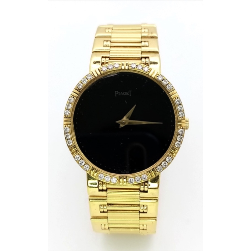 237 - A PIAGET 18K GOLD LADIES DRESS WATCH WITH DIAMOND BEZEL , GOLD HANDS ON A BLACK DIAL , QUARTZ MOVEME... 