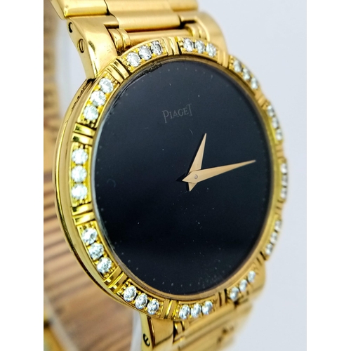 237 - A PIAGET 18K GOLD LADIES DRESS WATCH WITH DIAMOND BEZEL , GOLD HANDS ON A BLACK DIAL , QUARTZ MOVEME... 