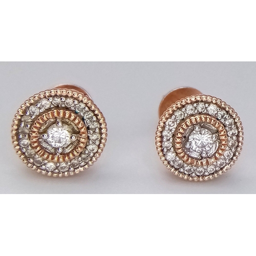 240 - A PAIR OF 14K ROSE GOLD DIAMOND SET STUD EARRINGS. 2G. 0.30CT