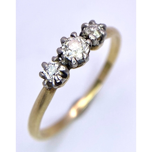 303 - A 18K YELLOW GOLD DIAMOND 3 STONE RING 0.25CT 1.9G SIZE N 1/2