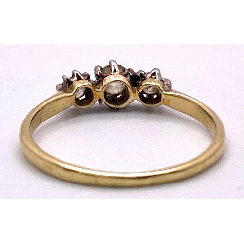 303 - A 18K YELLOW GOLD DIAMOND 3 STONE RING 0.25CT 1.9G SIZE N 1/2