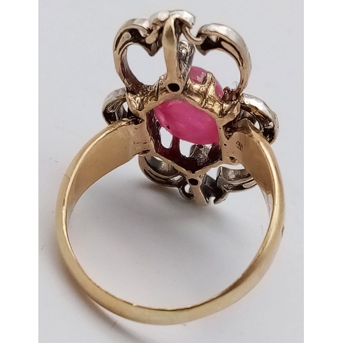 360 - An Art Deco 18K Yellow Gold, Burmese Ruby and Diamond Ring. Size L/M. Ruby cabochon in an old cut di... 