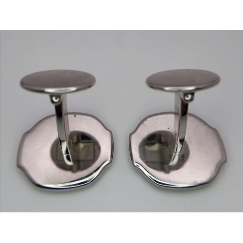 390 - A PAIR OF 18K WHITE GOLD PATEK PHILIPPE DESIGNER CUFFLINKS.   23gms