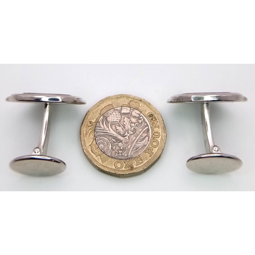 390 - A PAIR OF 18K WHITE GOLD PATEK PHILIPPE DESIGNER CUFFLINKS.   23gms