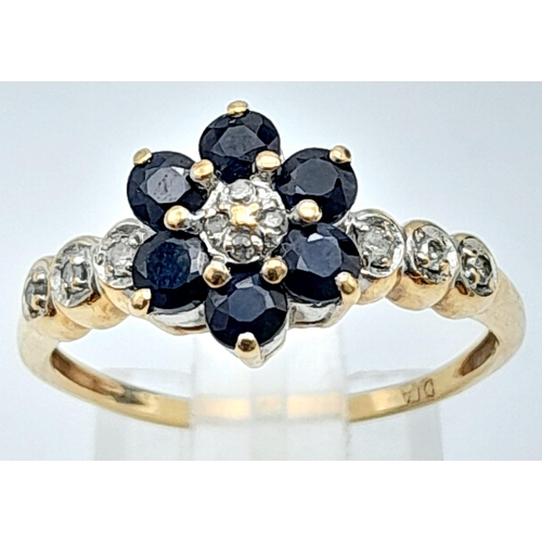 772 - A 9K YELLOW GOLD DIAMOND & SAPPHIRE CLUSTER RING IN THE FLORAL DESIGN 2G SIZE O/P
ref: A/S 4008