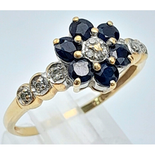 772 - A 9K YELLOW GOLD DIAMOND & SAPPHIRE CLUSTER RING IN THE FLORAL DESIGN 2G SIZE O/P
ref: A/S 4008