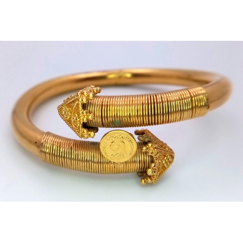 87 - An 18K Yellow Gold (x-ray tested) Asian Inspired Bangle. Almost a 'Last Days of the Raj' Feel with a... 