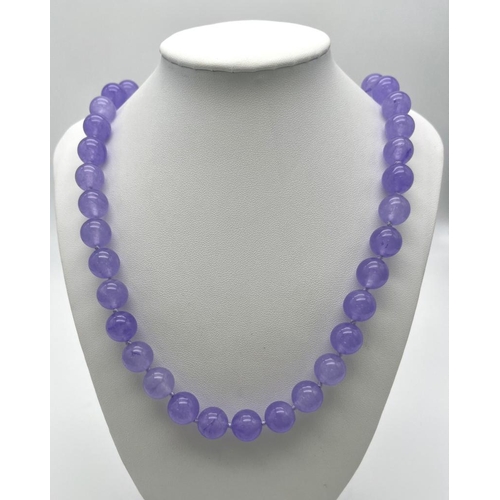 382 - A Lavender Jade Large Bead Necklace. Gilded clasp. 12mm beads. 56cm necklace length.