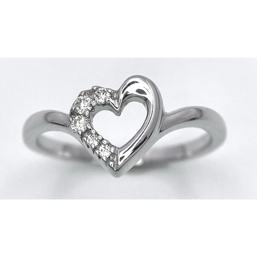 428 - A 18K WHITE GOLD DIAMOND SET HEART RING 0.10CT 2.6G SIZE M