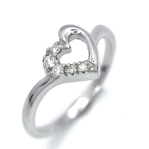 428 - A 18K WHITE GOLD DIAMOND SET HEART RING 0.10CT 2.6G SIZE M