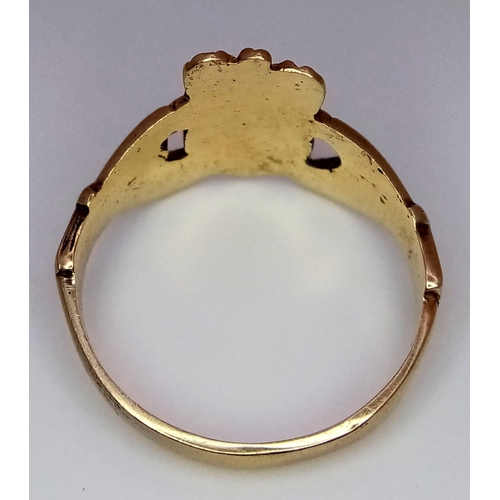 755 - A 9K YELLOW GOLD CLADDAGH RING. 3.2G. SIZE O