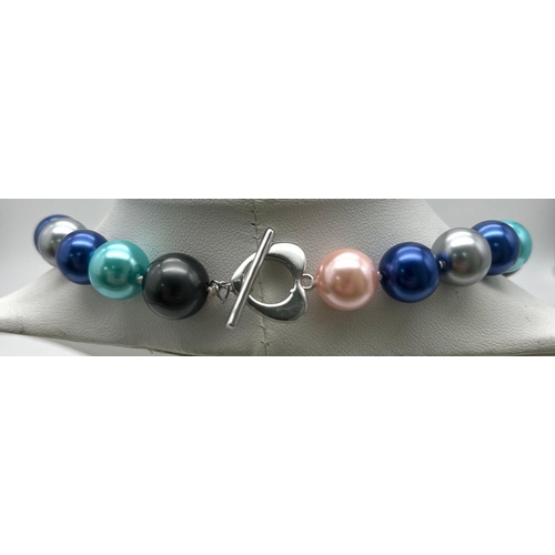 766 - A Multi-Coloured South Sea Pearl Shell Necklace. Metallic pink, blues and grey 12mm beads. Heart cla... 