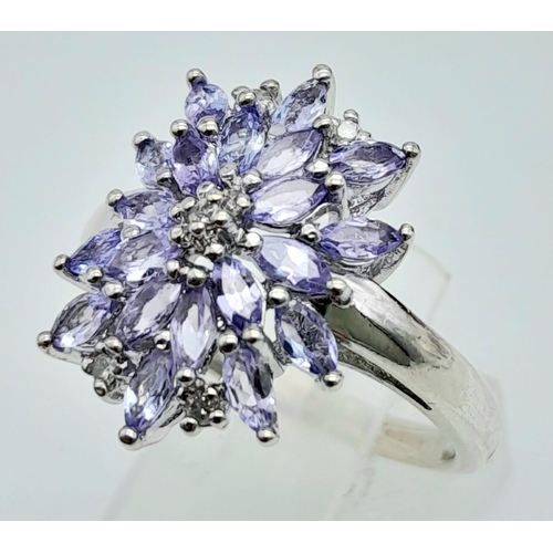 1222 - A STERLING SILVER DIAMOND & IOLITE SET MARQUISE SHAPED CLUSTER RING. TOTAL WEIGHT 4.2G. SIZE P